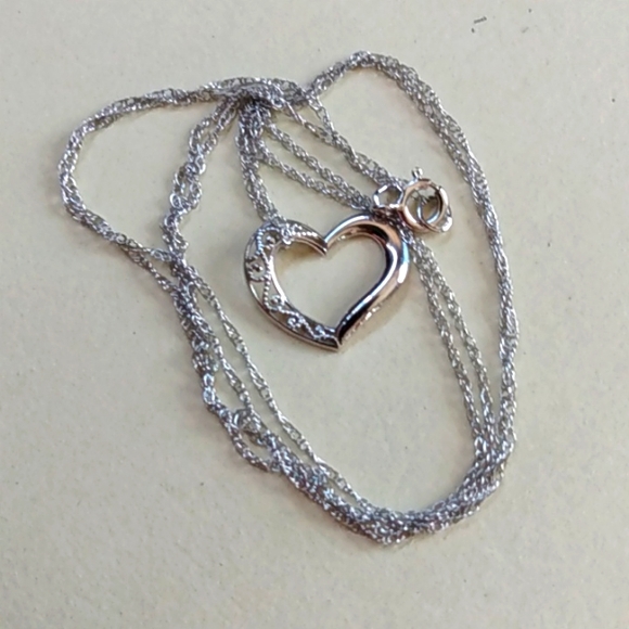 10k white gold open heart on a 14k white gold chain necklace